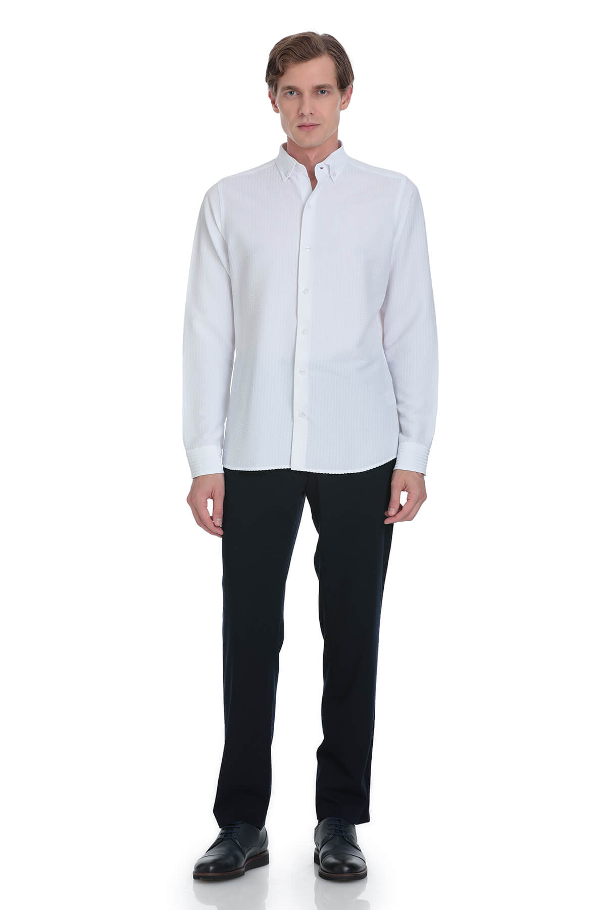 White long-sleeved button-down shirt with a classic collar and clean, tailored fit.