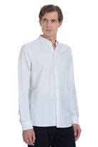White long-sleeved button-down shirt with a classic collar and neatly pressed fabric.