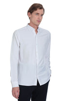 A crisp white long-sleeved button-down shirt with a classic collar and neatly pressed fabric.