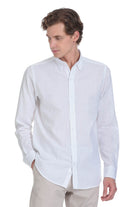 White long-sleeved button-down shirt with a classic collar and neatly pressed fabric.