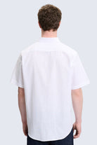 Comfort fit white short sleeve cotton shirt with crisp collar and tailored fit for casual wear