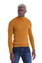 A mustard-yellow ribbed knit turtleneck sweater.