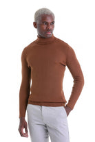 A ribbed, caramel-colored turtleneck sweater with a fitted silhouette.