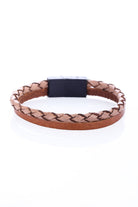 Tan braided leather bracelet with a black magnetic clasp.