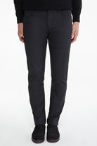 Black tailored trousers with a sleek, modern cut and subtle stitching details.
