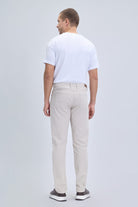 Beige slim-fit dynamic fit pocket low waist linen-tone casual pants with modern cut and subtle stitching details for smart casual wear