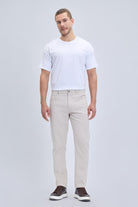 Beige linen-tone dynamic fit chino trousers with pocket low waist and subtle stitching details for smart casual wear