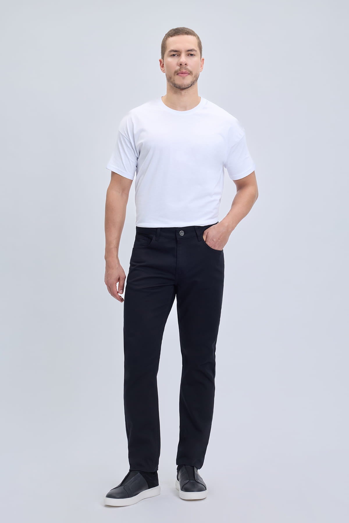 Dynamic fit black cotton gabardine casual pants in slim-fit denim with five-pocket design for smart casual dress