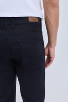 Dynamic fit black cotton gabardine casual pants with brown leather brand patch ideal for smart casual dress
