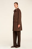 A sleek, chocolate-brown wool overcoat with a structured collar and matching buttoned front.