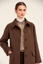 Brown wool coat with a classic collar and dark buttons.