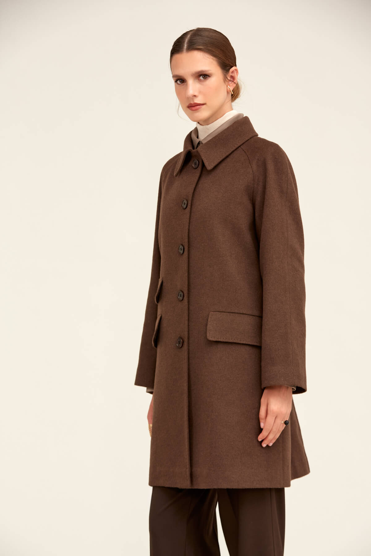 A classic brown wool coat with a notched collar and front button closure.