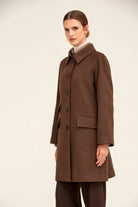 A classic brown wool coat with a notched collar and front button closure.