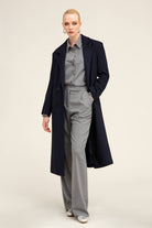 Navy blue wool overcoat with double-breasted front and notched lapels