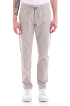 Beige corduroy chino pants with a drawstring waistband.