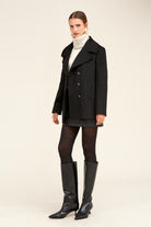 Black double-breasted wool coat with notched lapels and silver buttons