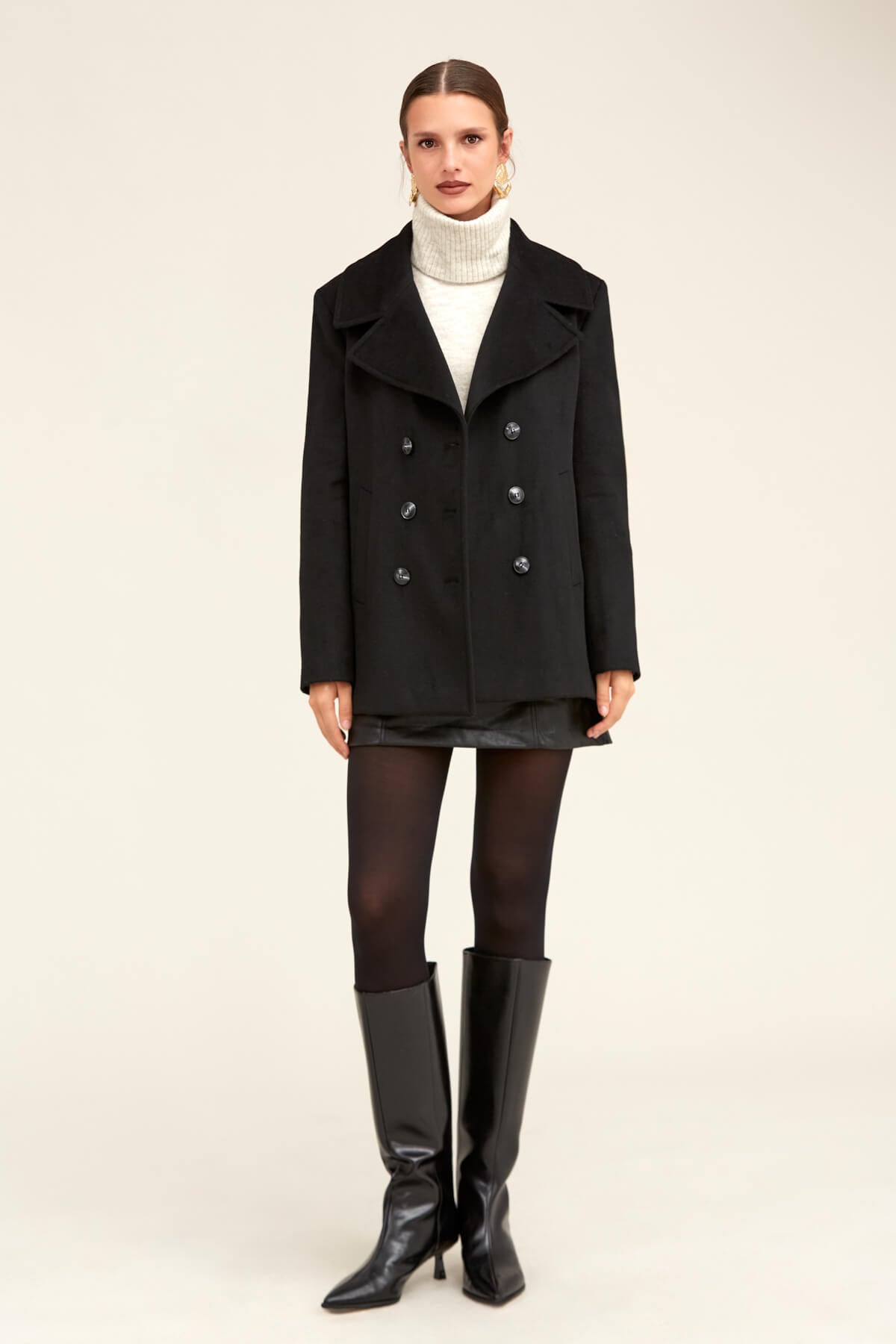 Black double-breasted wool coat with silver buttons.