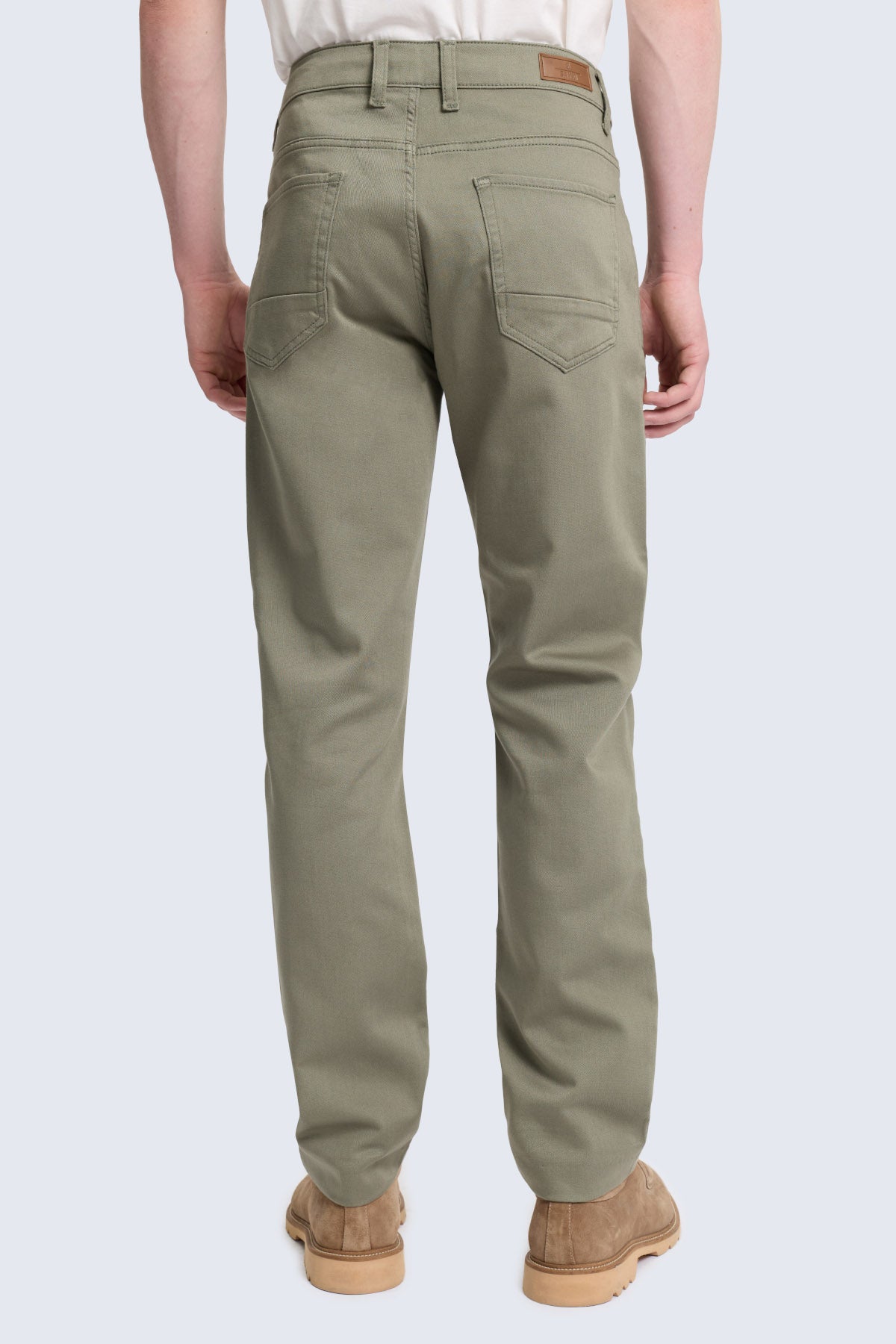 Olive green dynamic fit cotton gabardine chino pants with five pockets and brown leather brand patch for smart casual wear