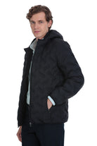 Black quilted hooded jacket with a subtle textured pattern and contrasting light gray inner lining.