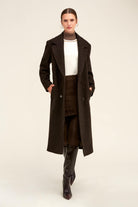 Black textured wool overcoat with a double-breasted front and notched lapels.