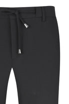 Black drawstring pants with silver-toned metal aglets on the cord ends.