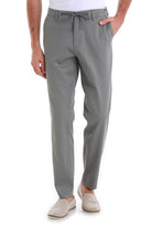 Gray chino trousers with a drawstring waistband.