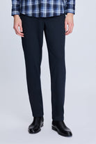 Dark navy wool blend trousers with a slim fit and subtle crease detail.