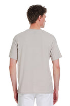 A light gray ecru oversize crew neck t shirt made of soft cotton with short sleeves for casual wear