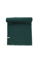 Deep green woolen scarf with a soft, textured surface and fringed edges.