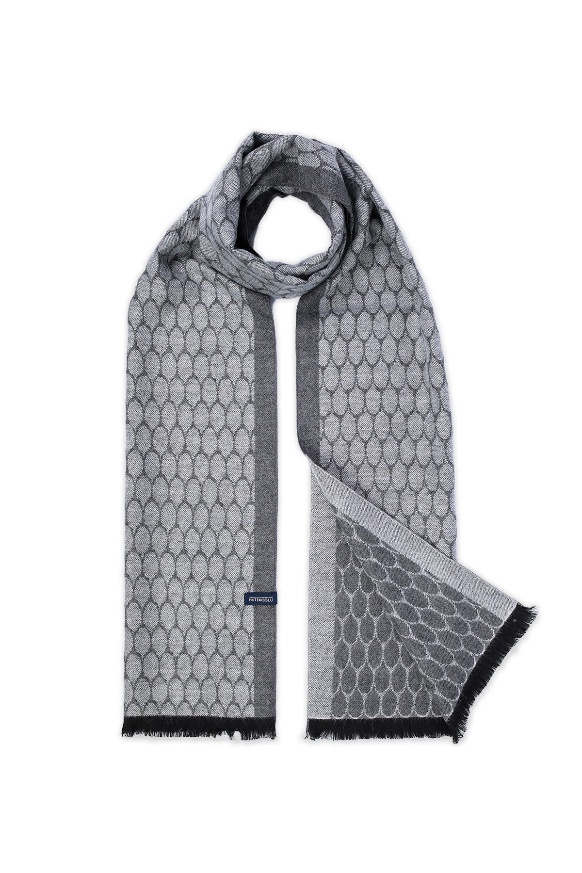 Gray patterned scarf with a repeating oval design and black fringe edges.