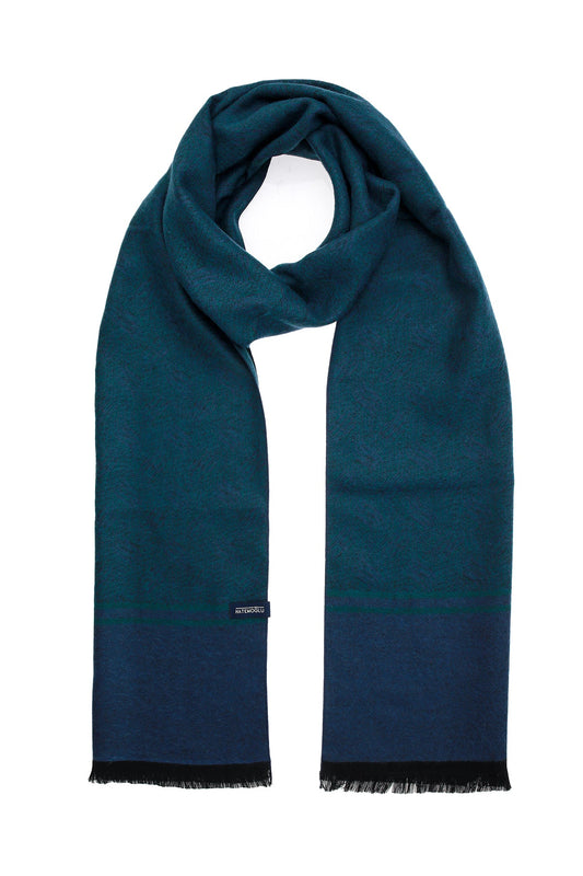 A deep teal and navy blue gradient scarf with black fringed edges.