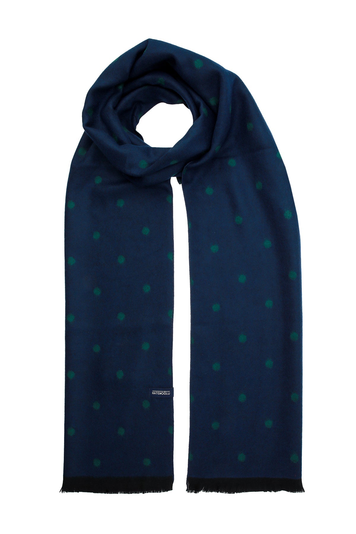 A navy blue scarf with a subtle pattern of teal polka dots, featuring black frayed edges and a small brand tag.