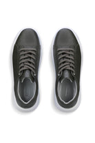 Black leather sneakers with white soles and gray laces.