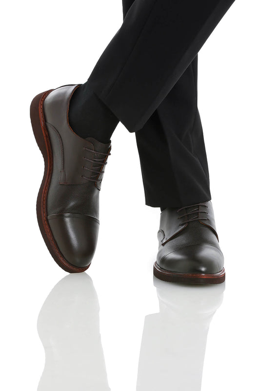 Dark brown leather cap-toe dress shoes with a subtle textured pattern on the upper and contrasting reddish-brown soles.