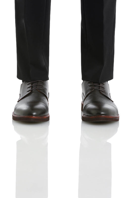 Black leather dress shoes with a subtle perforated texture and contrasting reddish-brown soles.