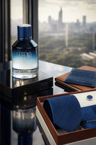 A sleek gradient blue glass perfume bottle with metallic cap etched legend for legend men’s eau de parfum 100 ml