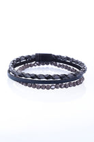 Black braided leather bracelet with a magnetic clasp and a row of dark gray beads.