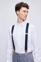 Navy clip suspenders with leather trim brown clasps and silver-toned metal hardware for stylish support