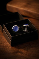 Silver round cufflinks featuring deep navy natural stone inlays for a classic elegant accessory