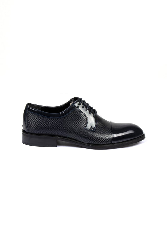 Black men’s dress shoe with a glossy toe cap and textured leather upper.