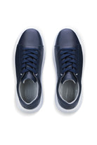 Navy blue leather sneakers with white soles and matching laces