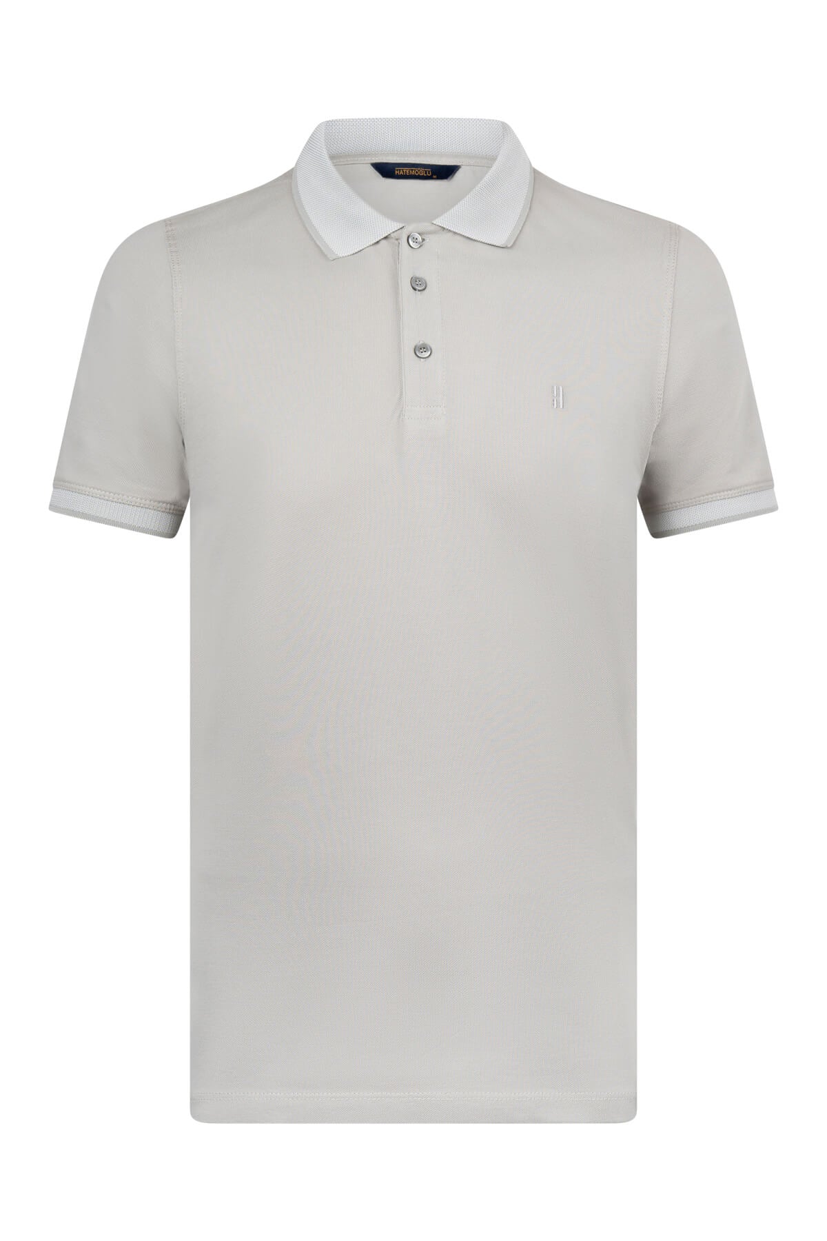 A crisp white short-sleeved polo shirt with a classic collar and subtle embroidered logo on the chest.