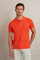 Bright orange short-sleeved polo shirt with a classic collar and white buttons.