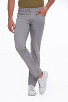 Gray slim-fit trousers with a clean, modern design and subtle stitching details.