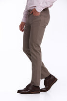 Khaki-colored, slim-fit trousers made of durable fabric with a classic design and visible stitching details.