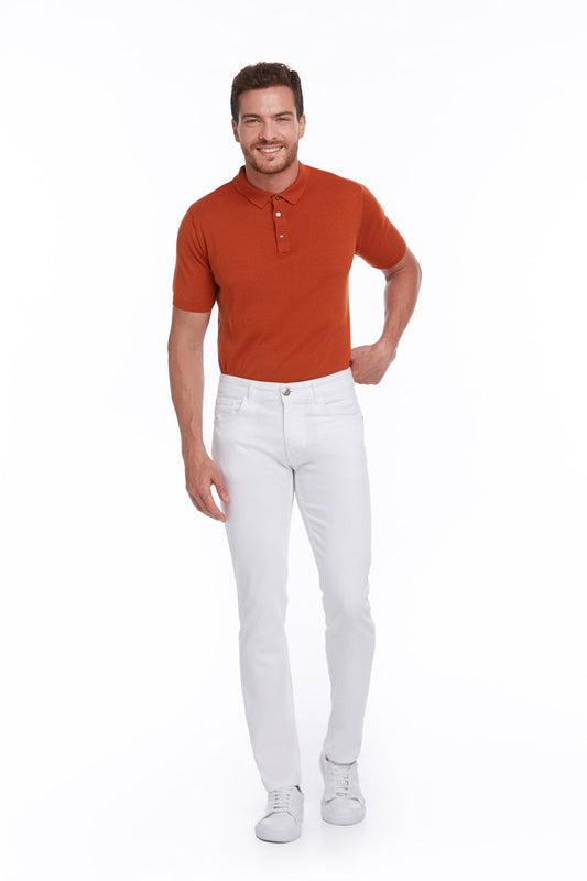 A man wearing a rust-orange short-sleeved polo shirt with a classic collar and buttoned placket.