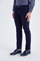 Dark navy blue slim-fit trousers with a subtle textured fabric and classic five-pocket design.