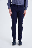 Dark navy blue slim-fit trousers with a subtle texture and classic five-pocket design.