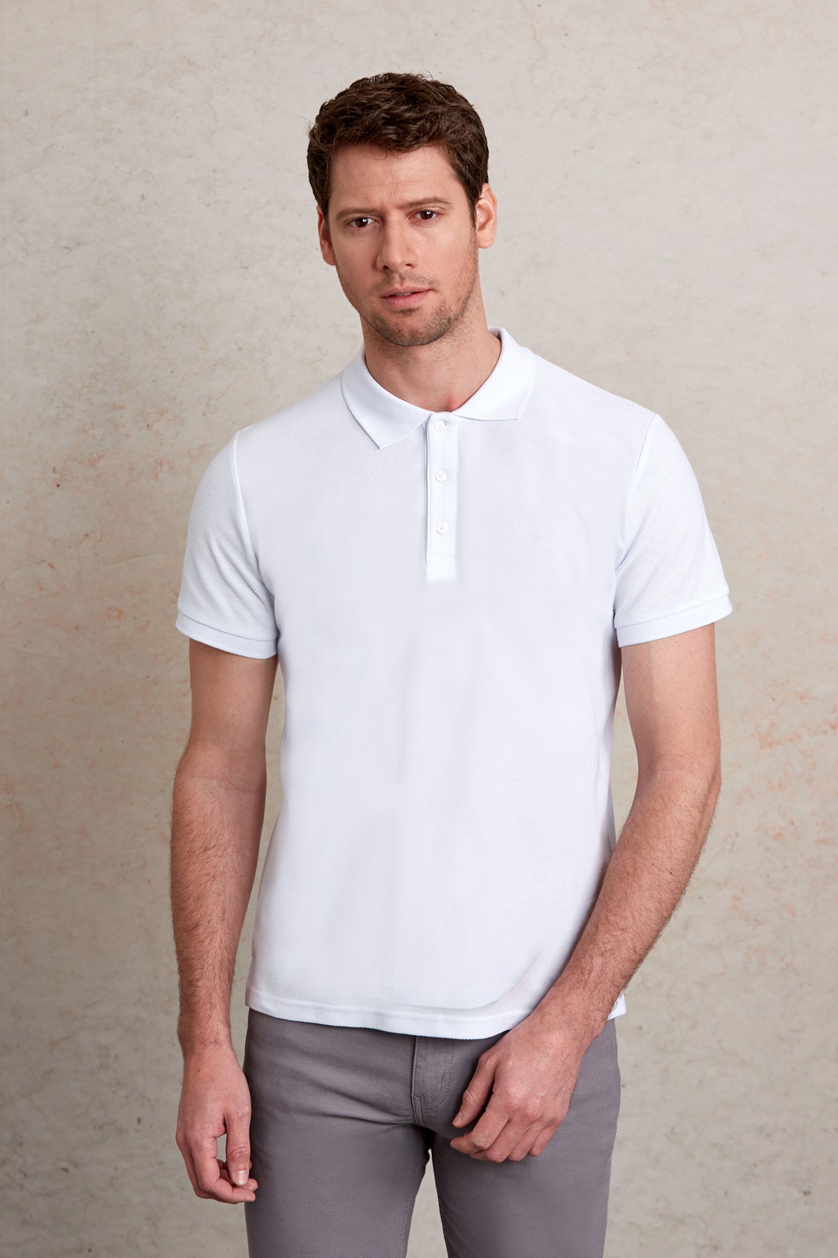 White short-sleeved polo shirt with a classic collar and button placket.