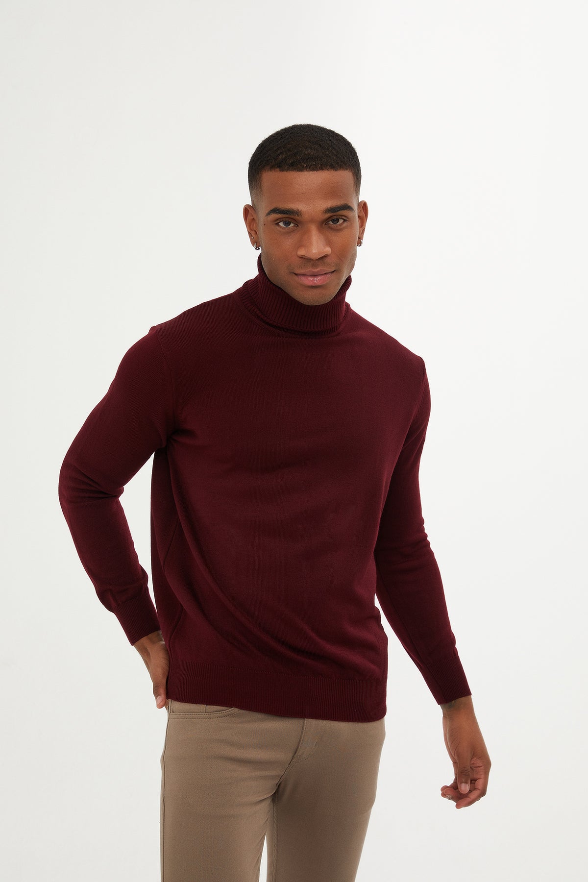 A rich burgundy turtleneck sweater with a smooth, fitted knit texture.